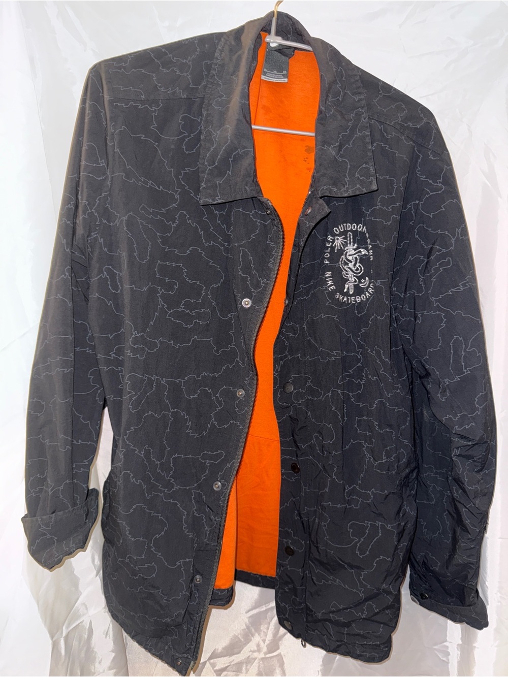 Nike Black Coach Jacket with Orange Lining and Chest Graphic